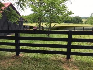 custom painted split rail wooden backyard fence