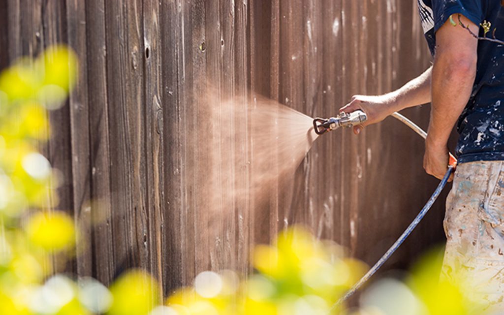 Cleaning wooden fence for spring