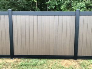 black and wood style vinyl fencing