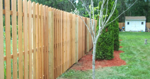 Wood picket fence for backyard privacy