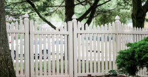 vinyl picket fence installed alongside gate