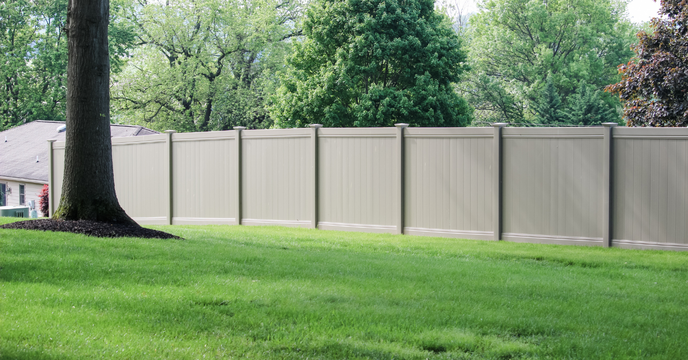 Tall fence surrounding backyard with seclusion