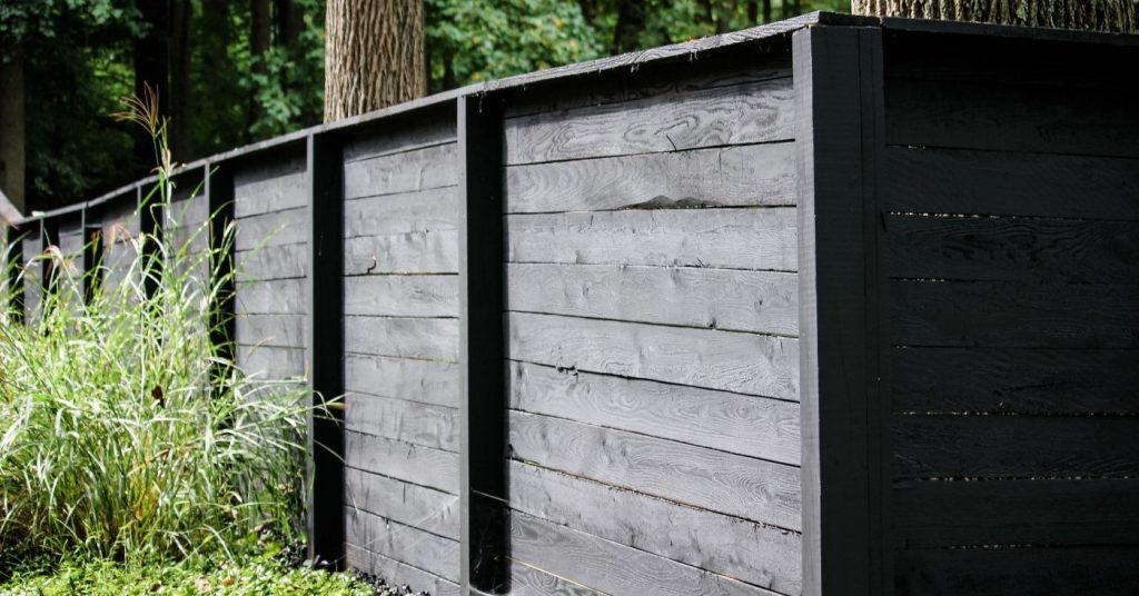 Modern black wooden fence for backyard privacy