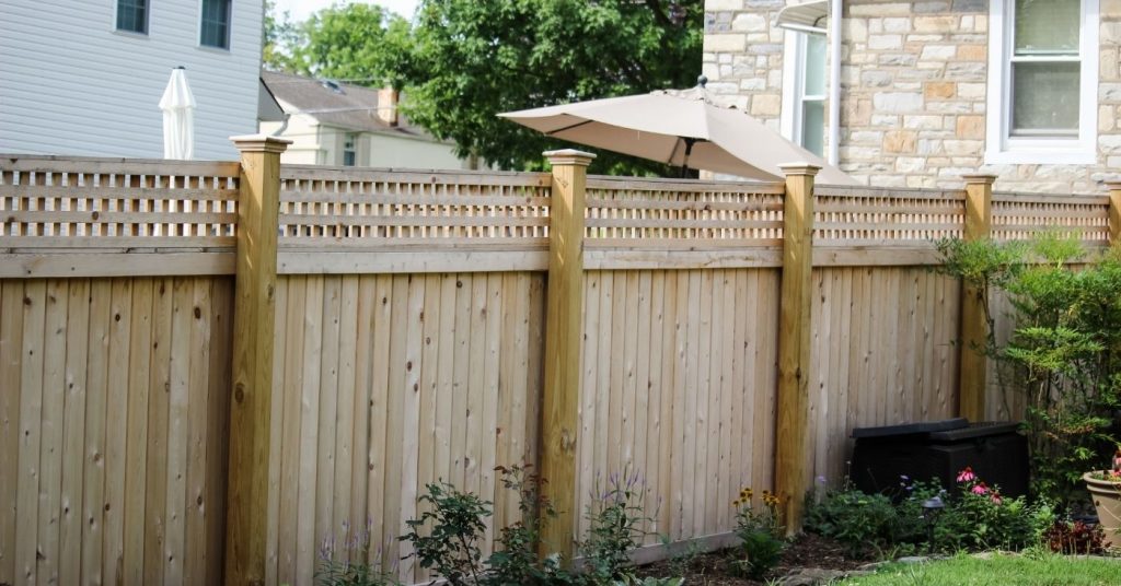 Wooden privacy fence providing total privacy for backyard