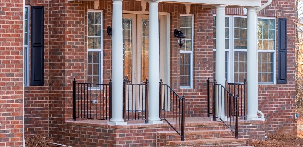 stylish black aluminum porch railing on new home build
