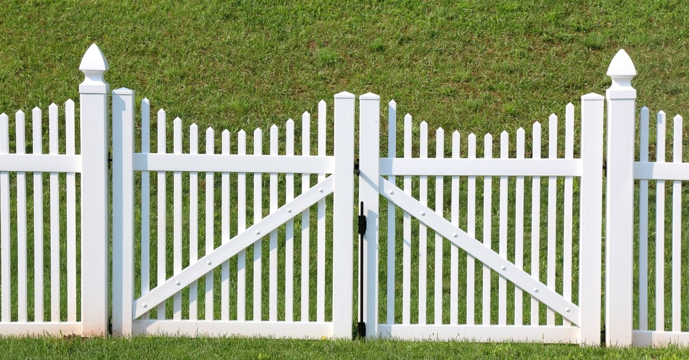 Traditional white privacy fence and gate