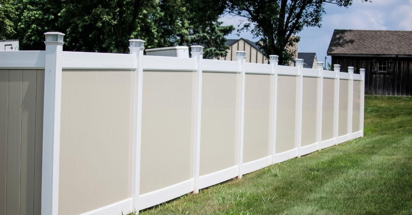 White and beige two tone vinyl fence