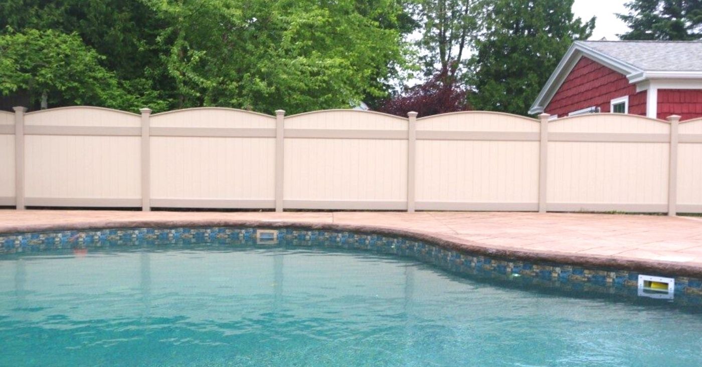Pool fence in tan with curved top