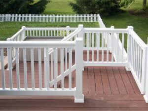 White vinyl railing installed for security on back deck