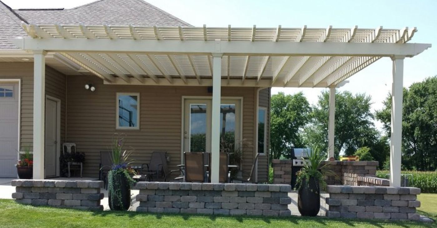 attached vinyl pergola adds value to this home