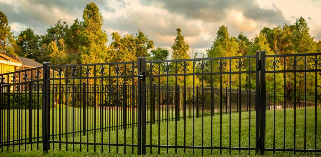 most durable fence material showing aluminum fence and sky