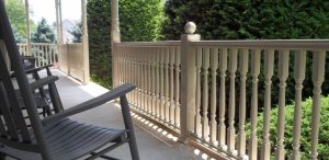 white residential railing deck porch with rocking chair